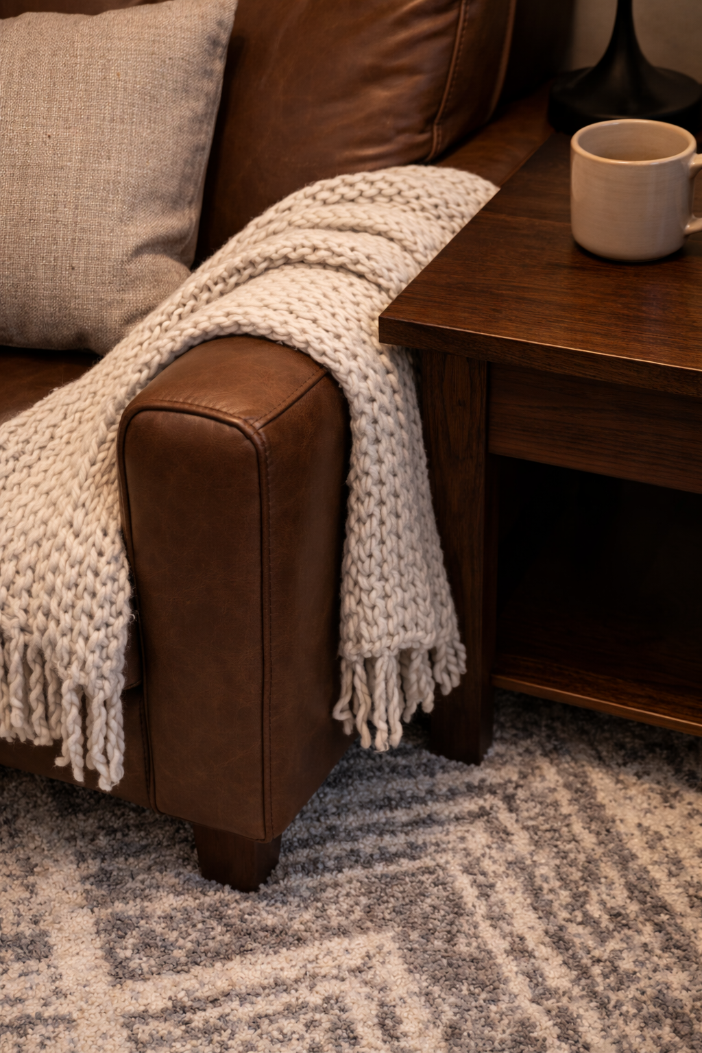 Layered living room textures showing pillows, throws, and mixed materials