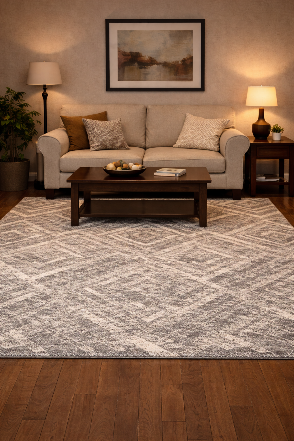 Modern geometric area rug in gray and cream anchoring living room furniture